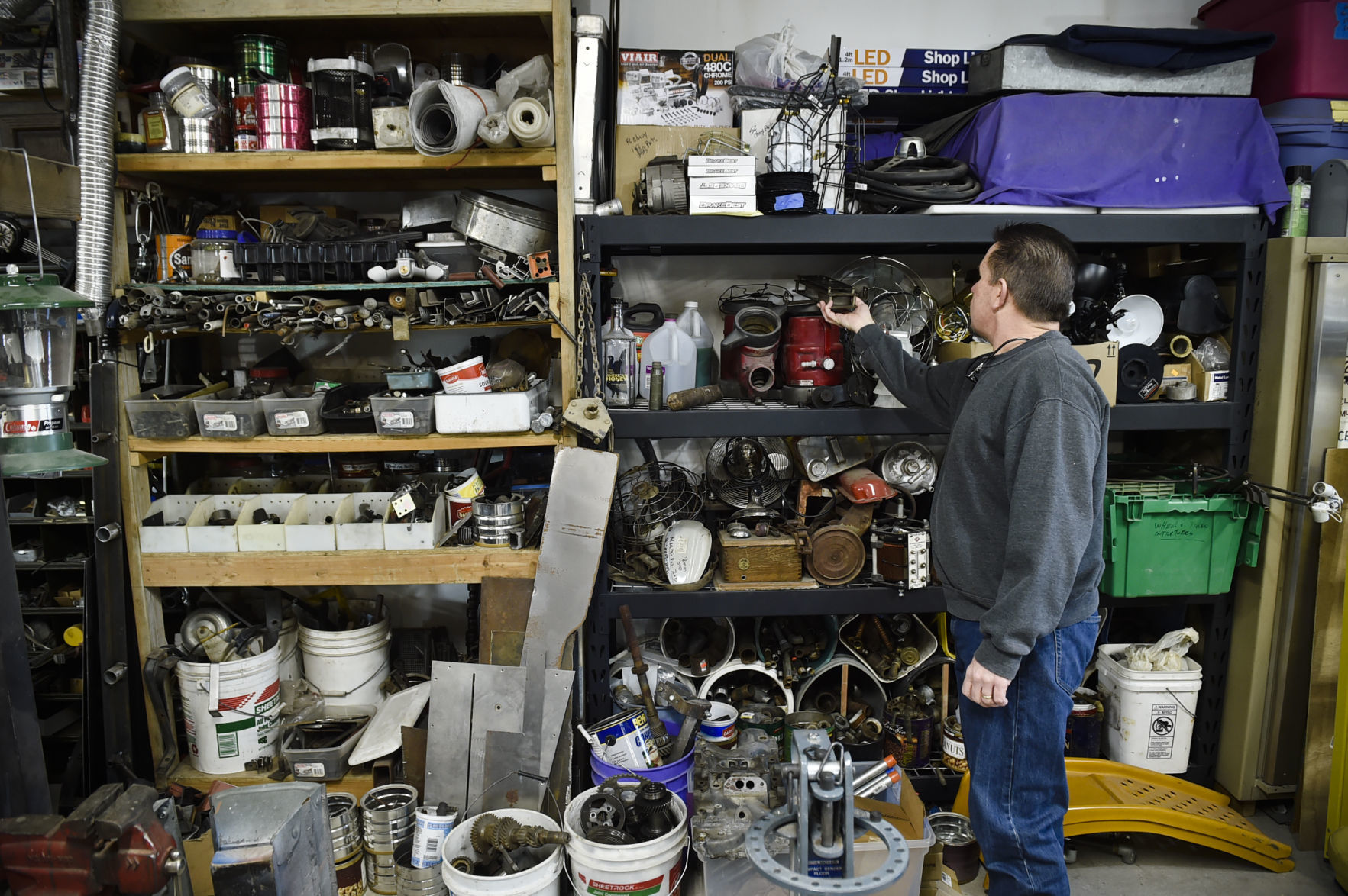 Reich sifts through his collection of antique parts